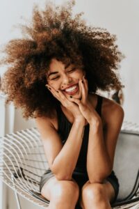 woman sitting and smiling